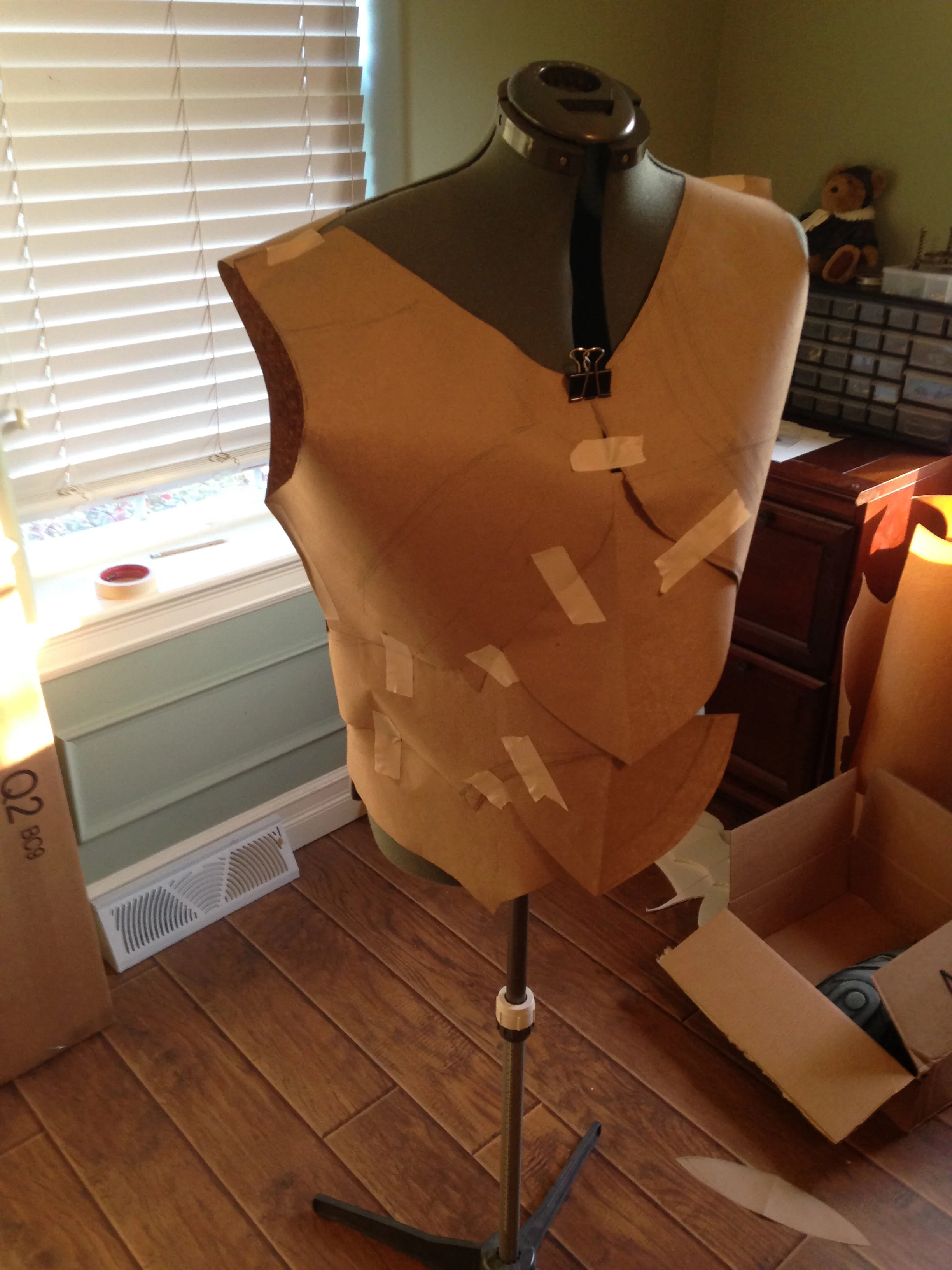 It starts with a pattern made from paper and masking tape. I had to make sure all of the pieces were symmetrical and that they fit together the way they needed to. It took quite a few adjustments before I arrived at this final pattern.