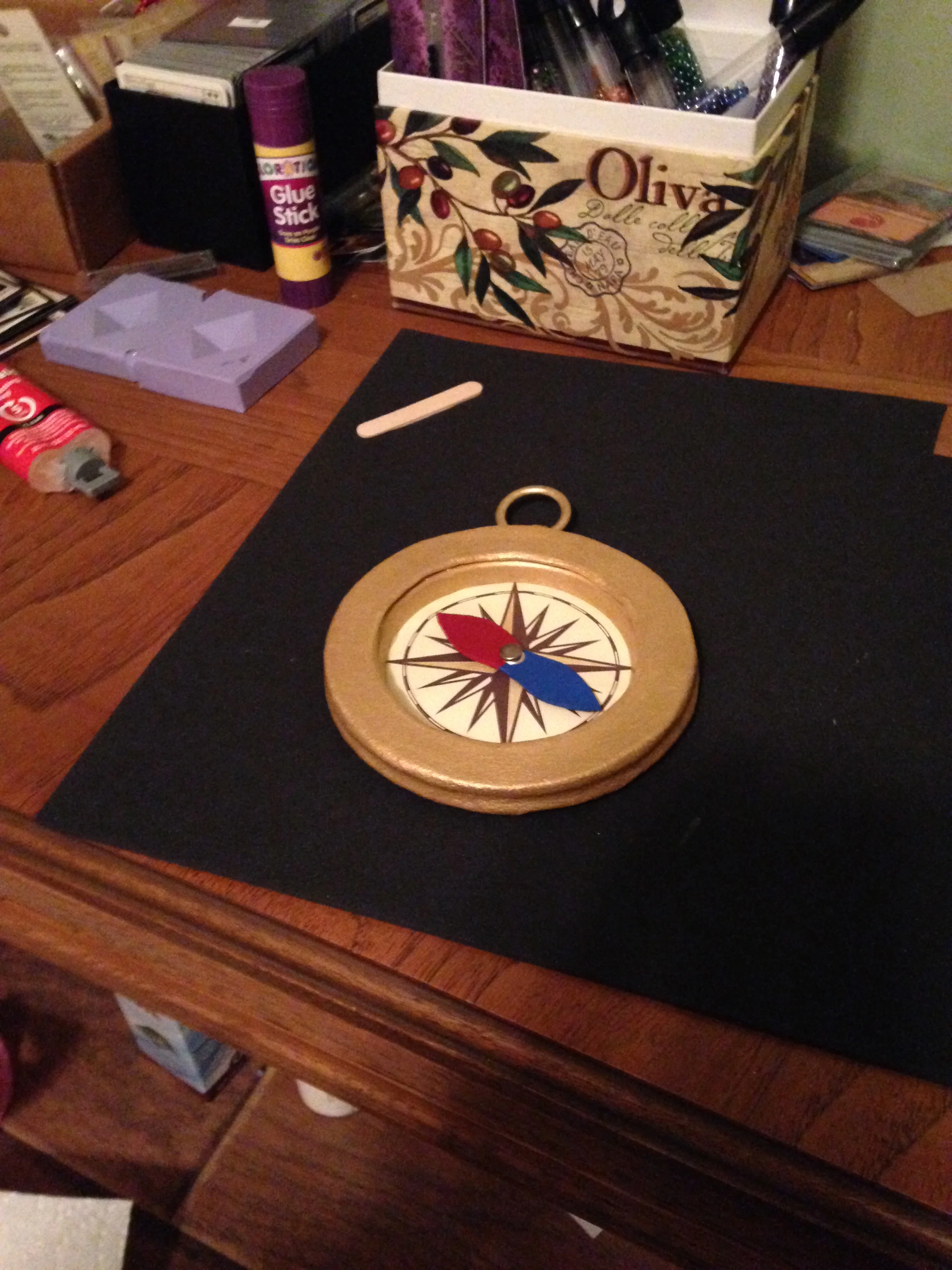 The compass is totally done minus the gold chord that it hangs from. And the thing in the middle actually spins!!