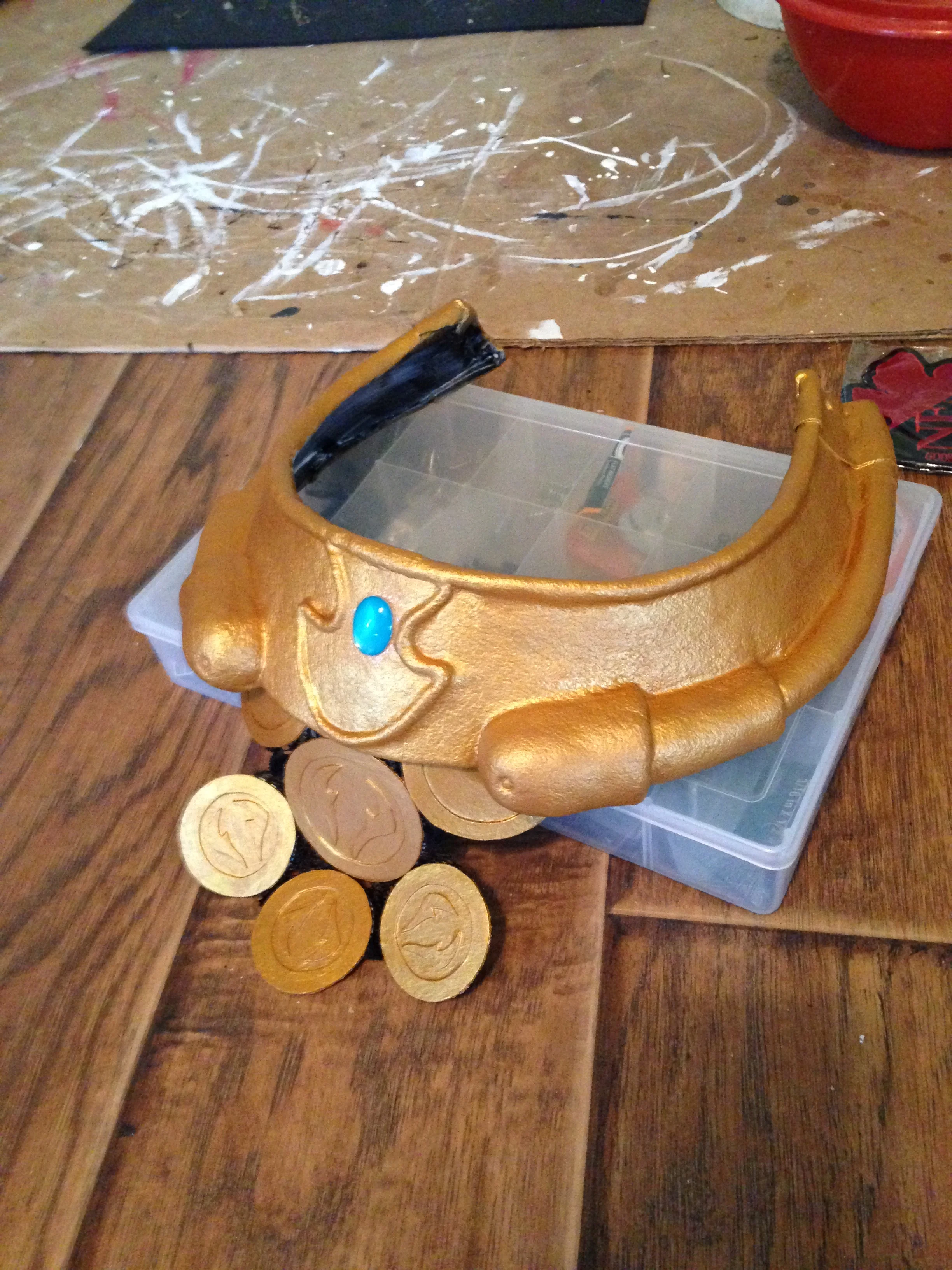 Paint, medallions, and a fake gem! BOOM! We're done!