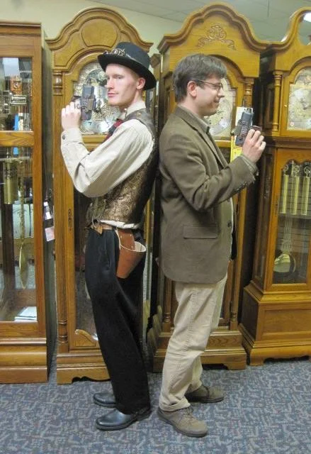 One of our earlier events was to Suburban Clock in Berea. They had a bunch of awesome music boxes (and I'm not talking little ballerinas in jewlery boxes, I mean giant boxes with fascinating workings, most of which could play multiple tunes). The owners were excited to have us all come in costume and I got this photo with our host, ready to duel.