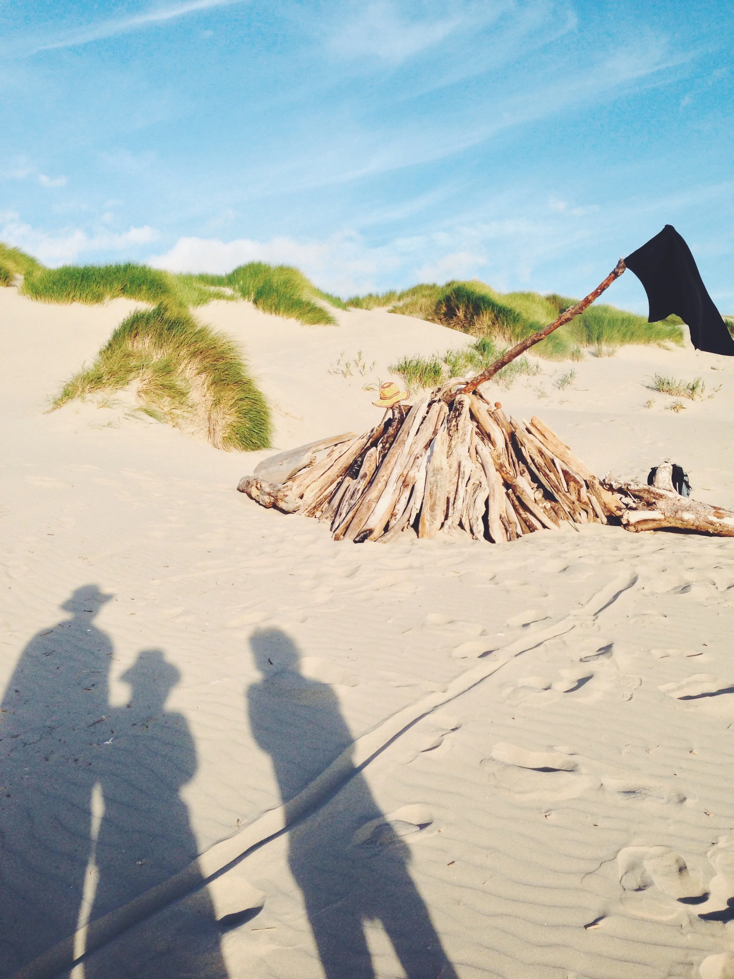 Inspecting our driftwood fort