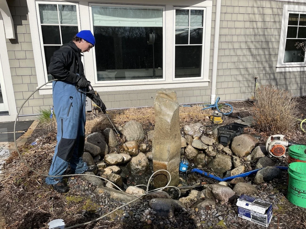 Powerwashing rocks how to clean backyard pond water feature