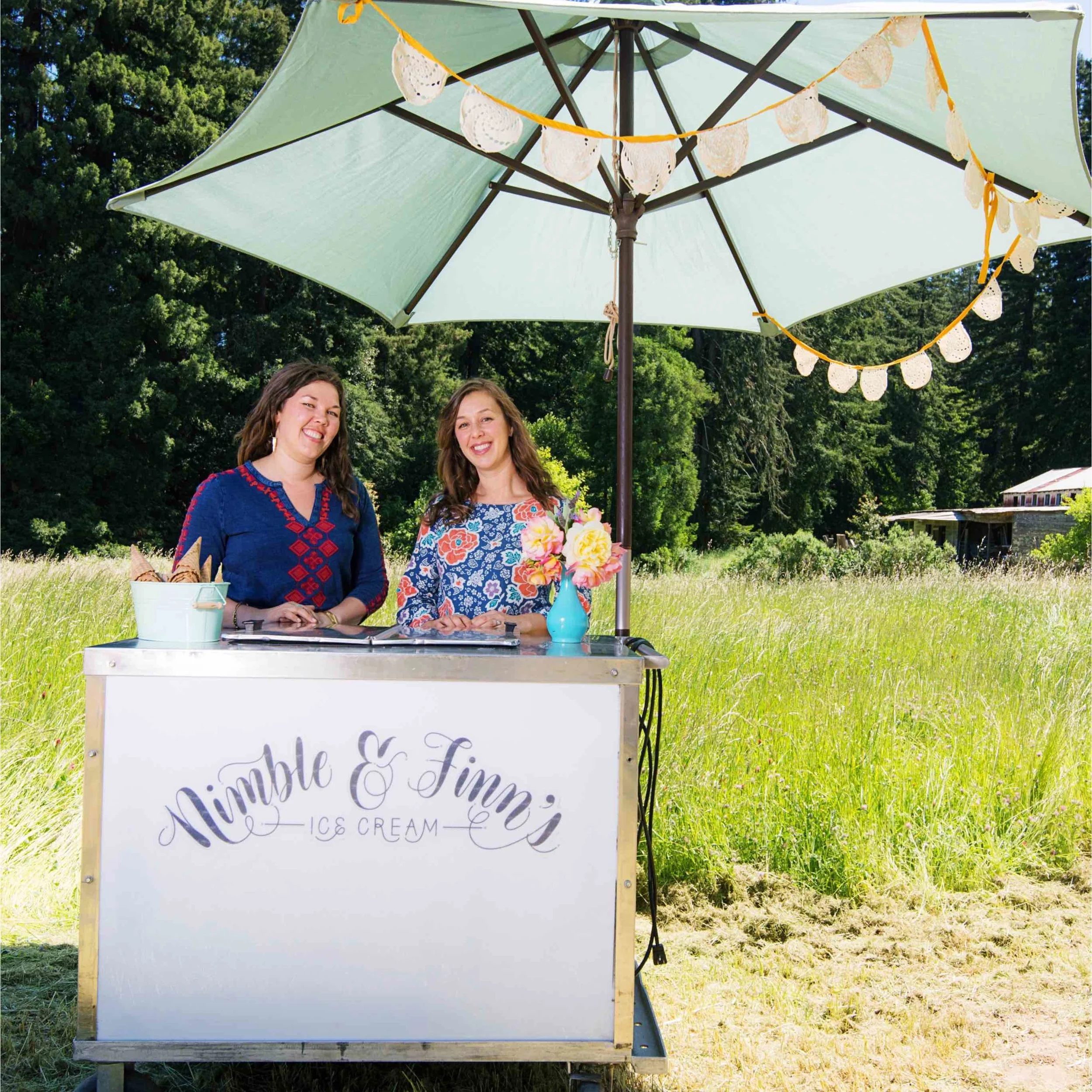 two people with brown hair behind Nimble & Finn’s ice cream cart.jpg