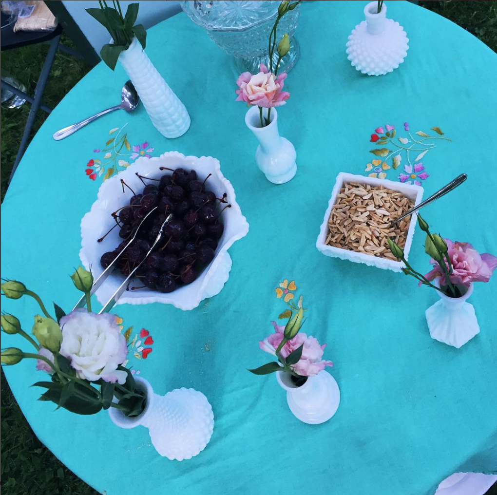 a table full of ice cream sundae toppings.png
