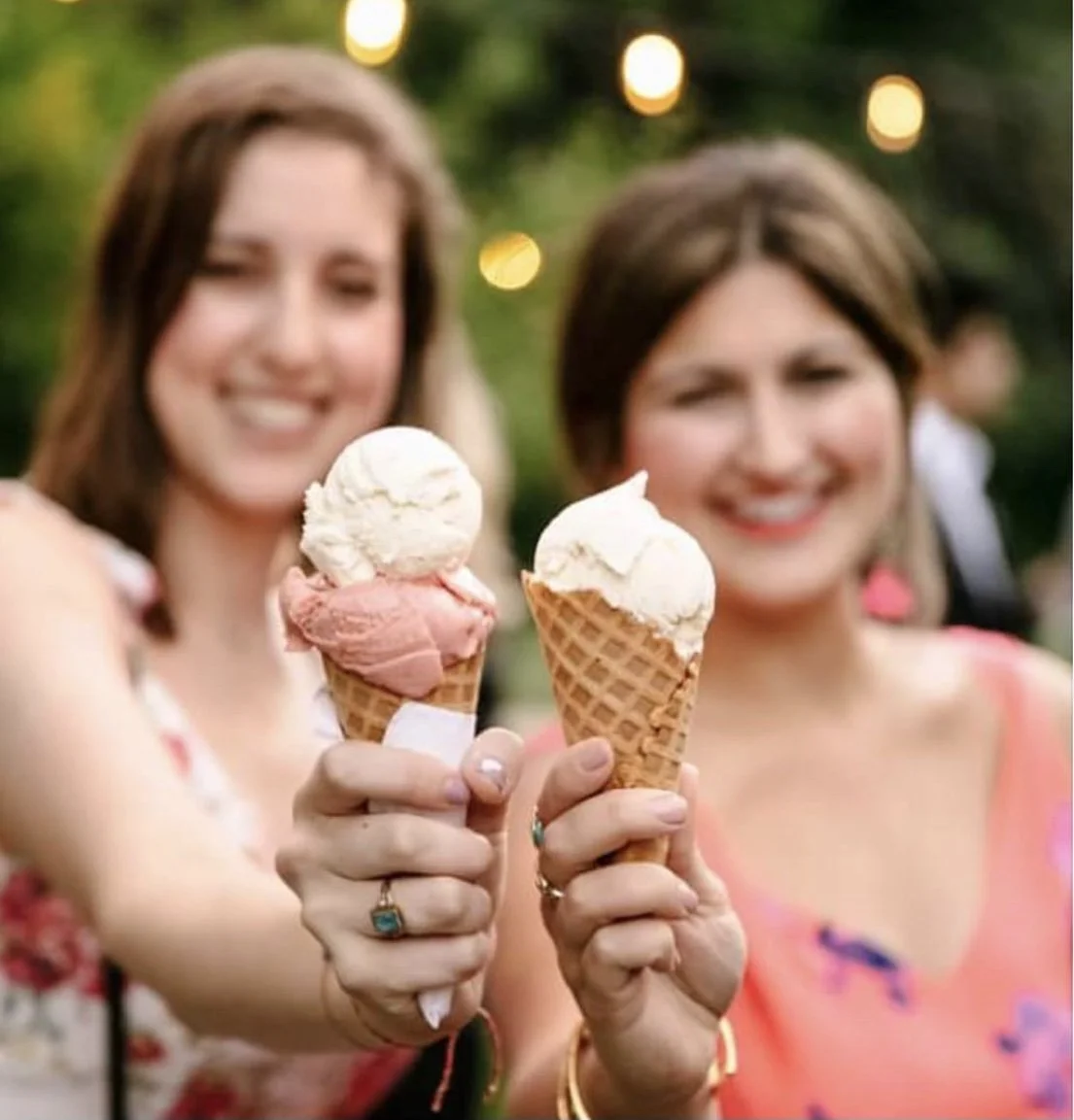 two people holding ice cream cones and smiling @jemerlingweddings.jpg