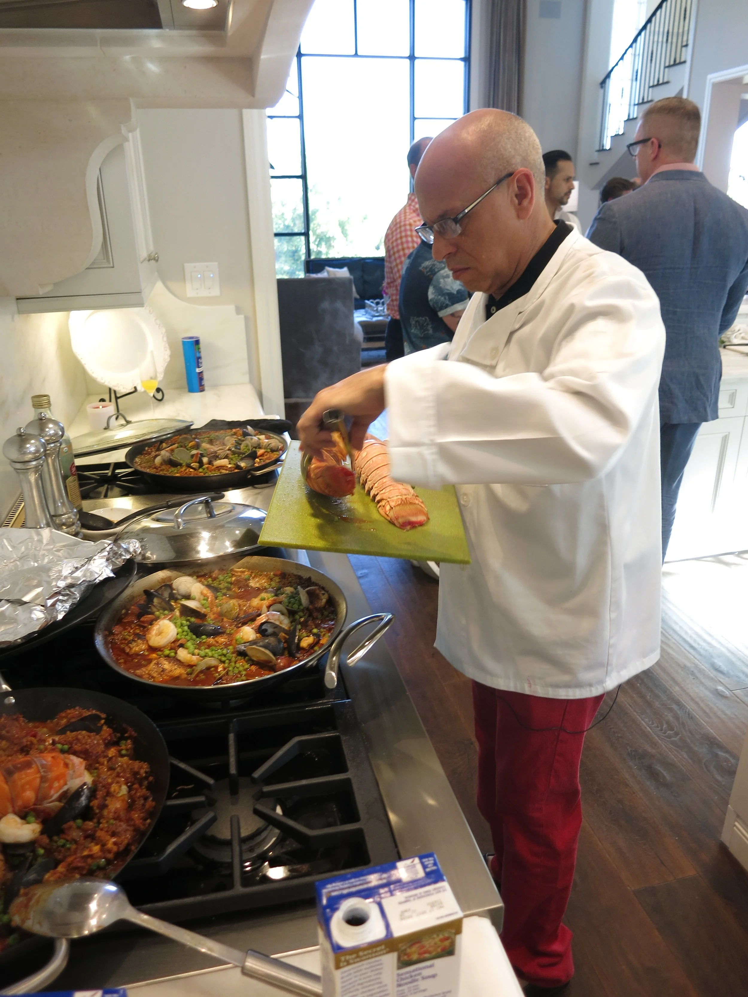 Cooking paella at a Candelaria Design open house.
