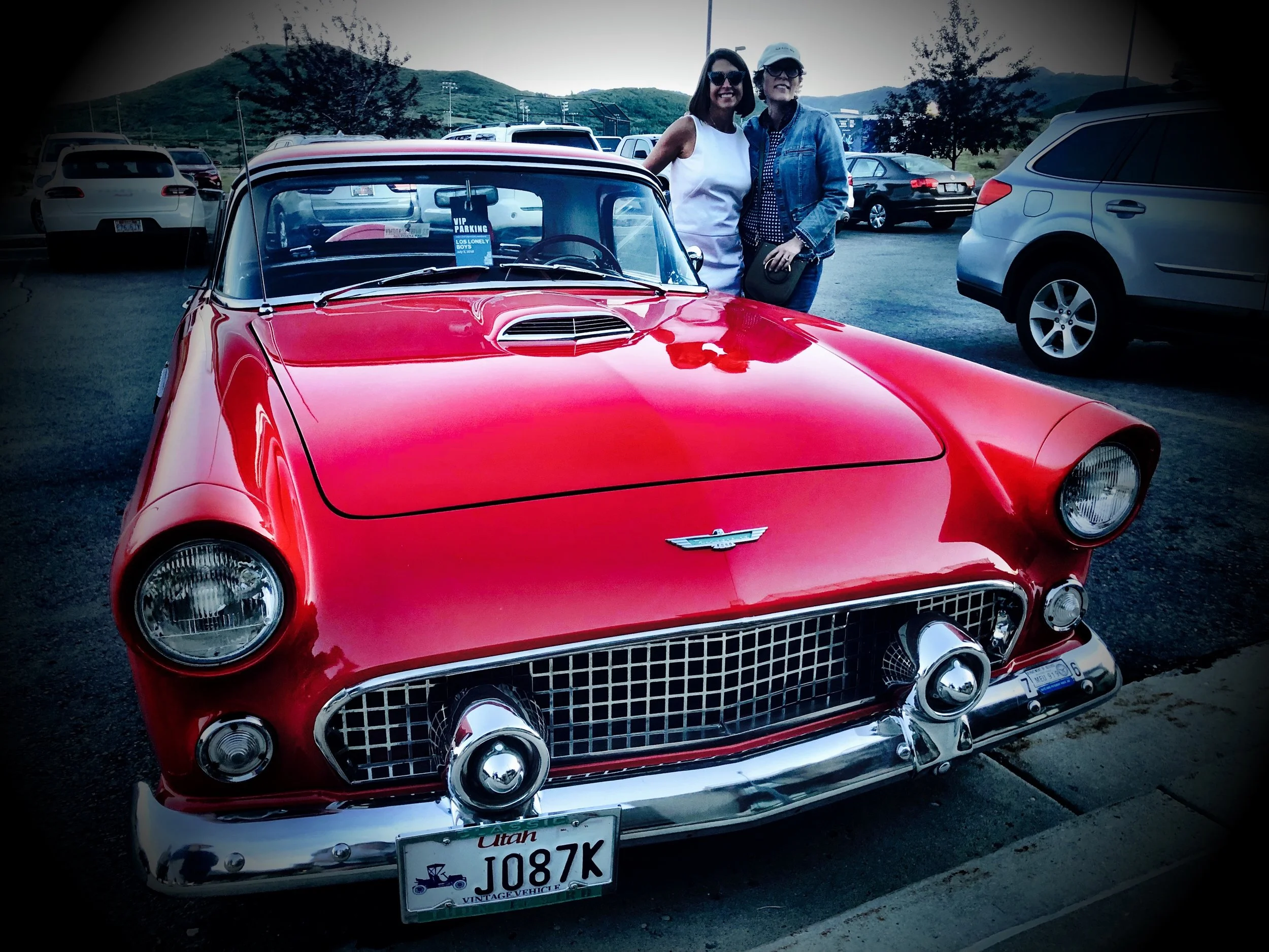 Isabel with her cousin Ember Conley and her classic Thunderbird in Park City at the Los Lonely Boys Concert July 2018