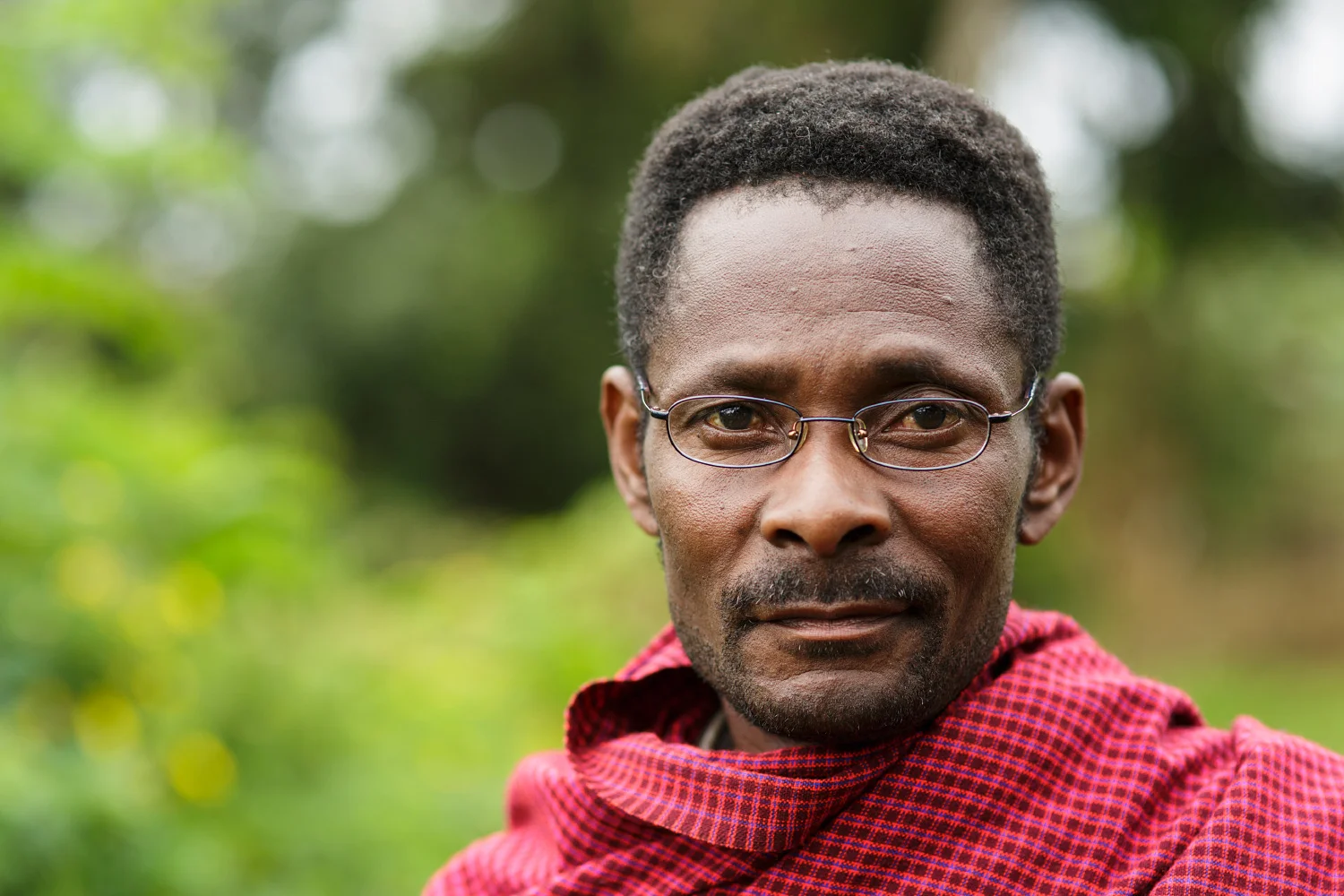Massai man in Kibosho-Umbwe and recipient of eyeglasses via the free eye clinic provided by Artists for World Peace.