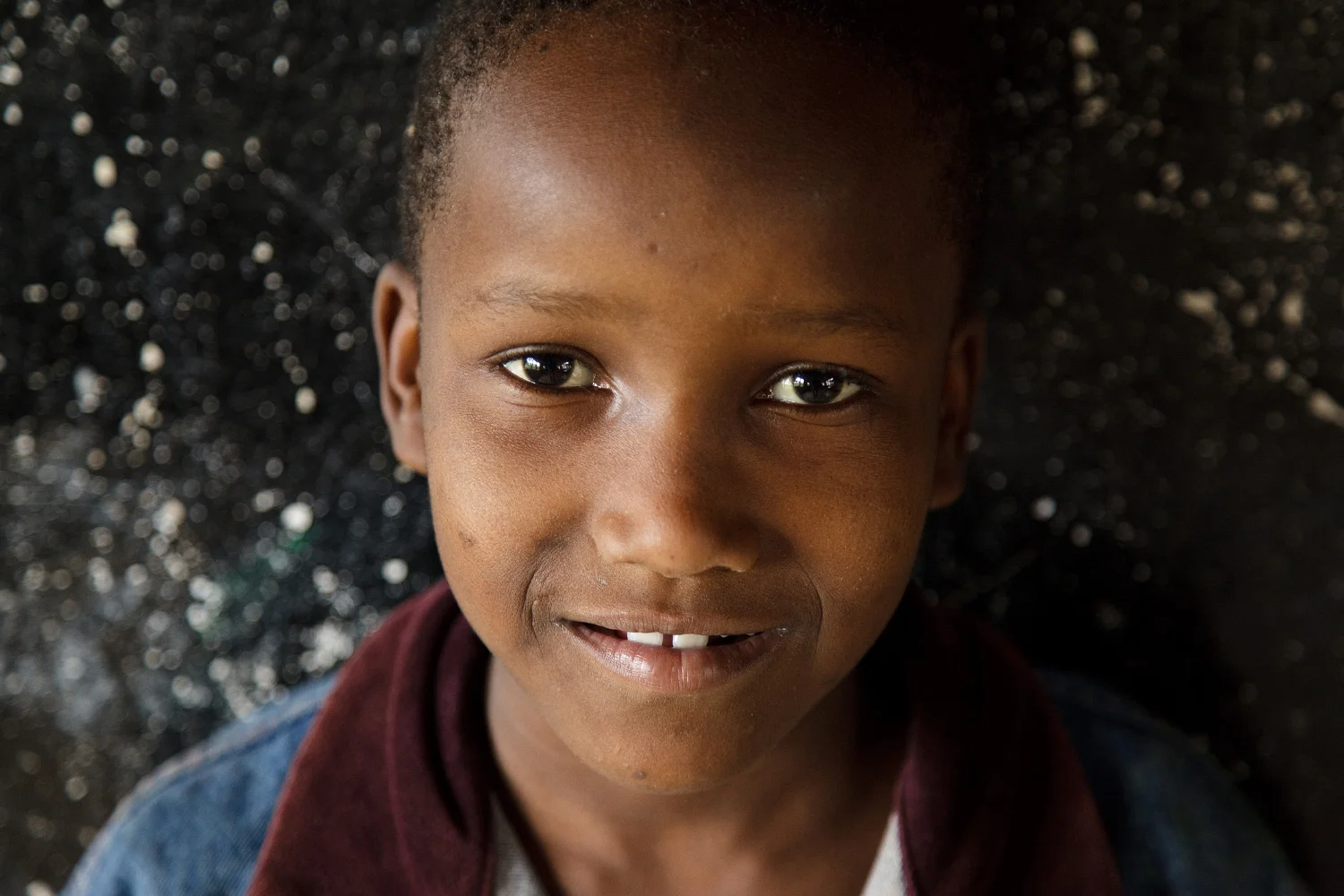 Delphina, one of Artists for World Peace's sponsored children in the school house at Good Hope Orphanage.