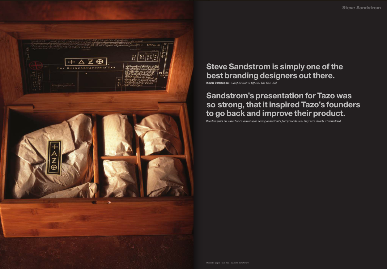 A wooden box containing six wrapped tea packages, with a Tazo logo on one package, alongside a black label with white text inside the lid describing the Tazo tea branding.