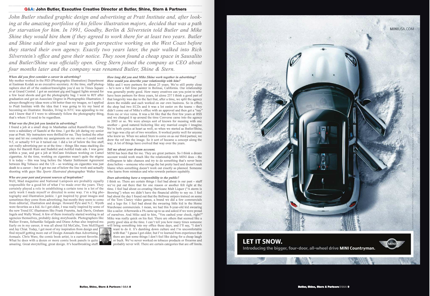 A silver MINI Countryman with black roof and mirror caps driving on snow-covered terrain, creating a snow spray behind it.