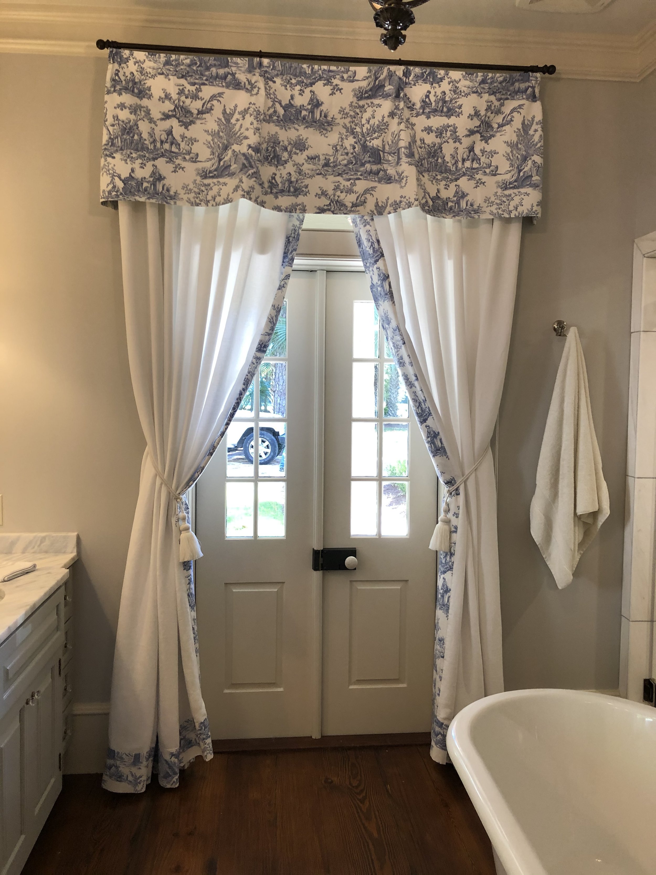Bathroom, during installation. Custom valance and drapes by Savannah Window Fashions.