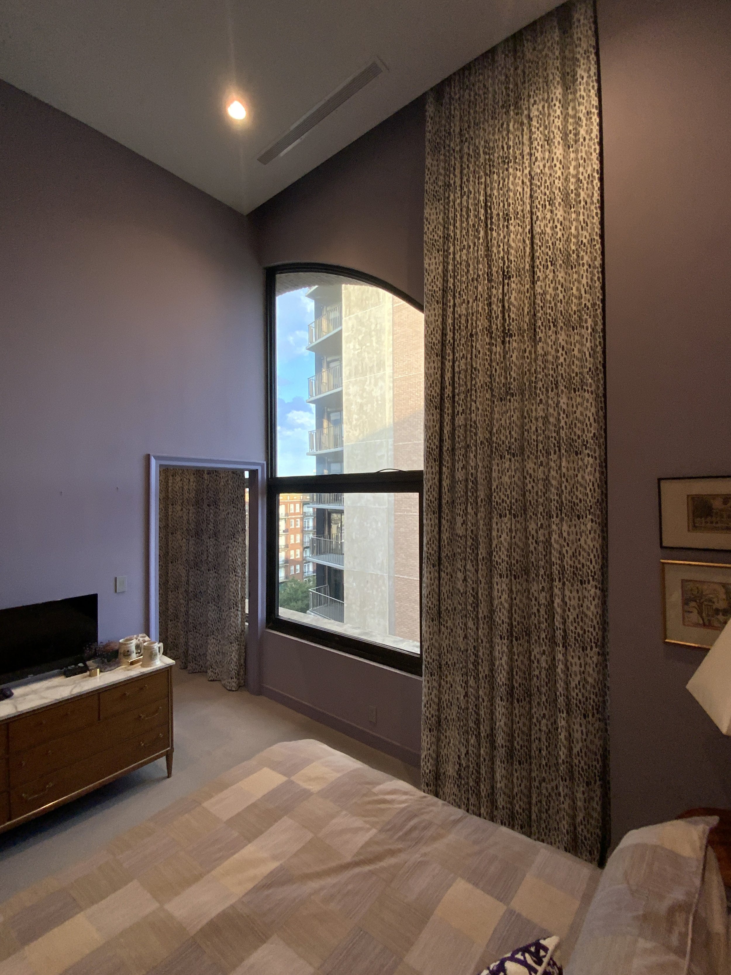   Motorization offers ease of use for oversized, heavy treatments, as seen in these 14-foot draperies.  