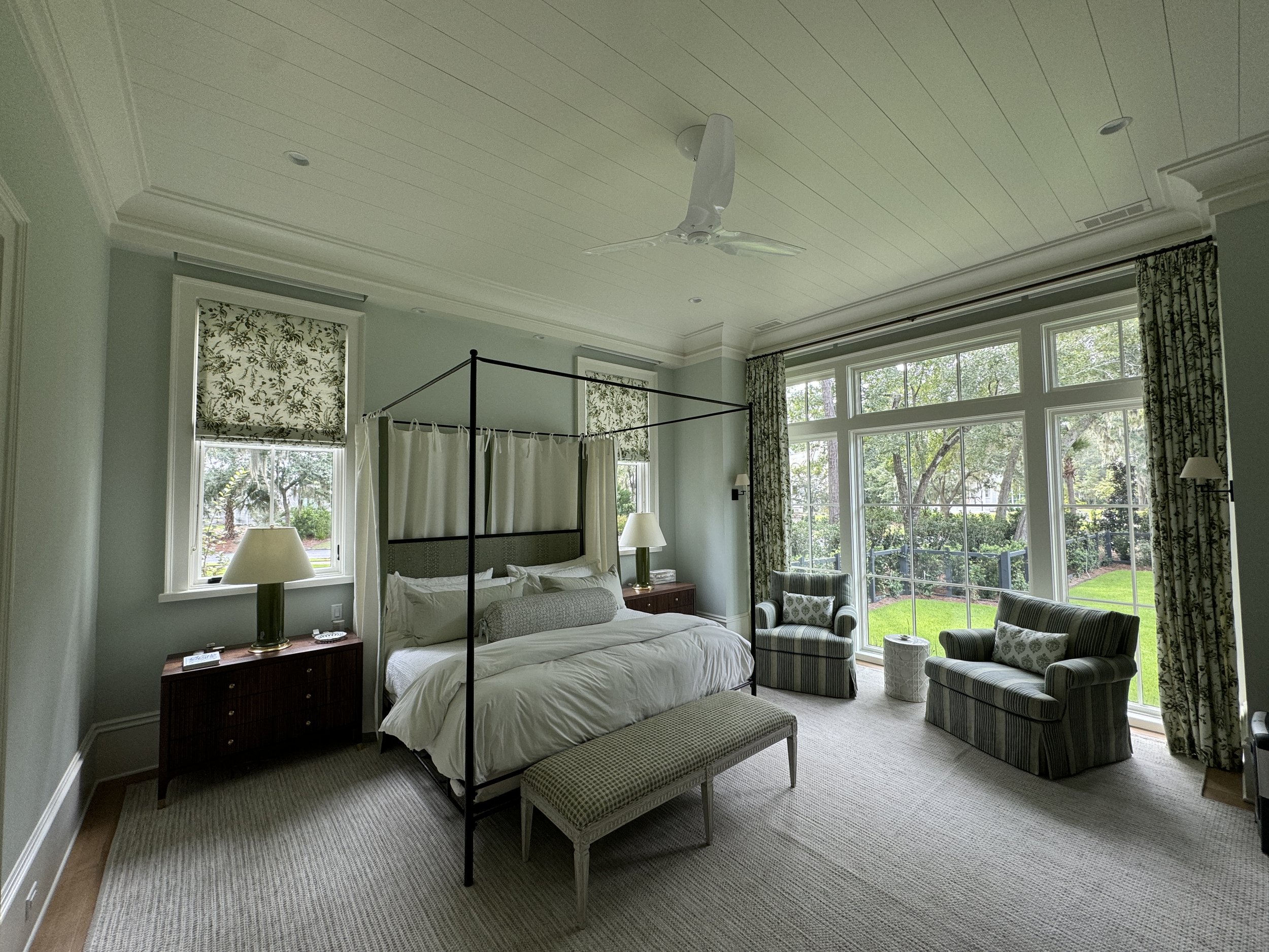   This bedroom installation included Roman shades, custom draperies, and panels for the canopy bed. Design by Sarah Bartholomew Design.  