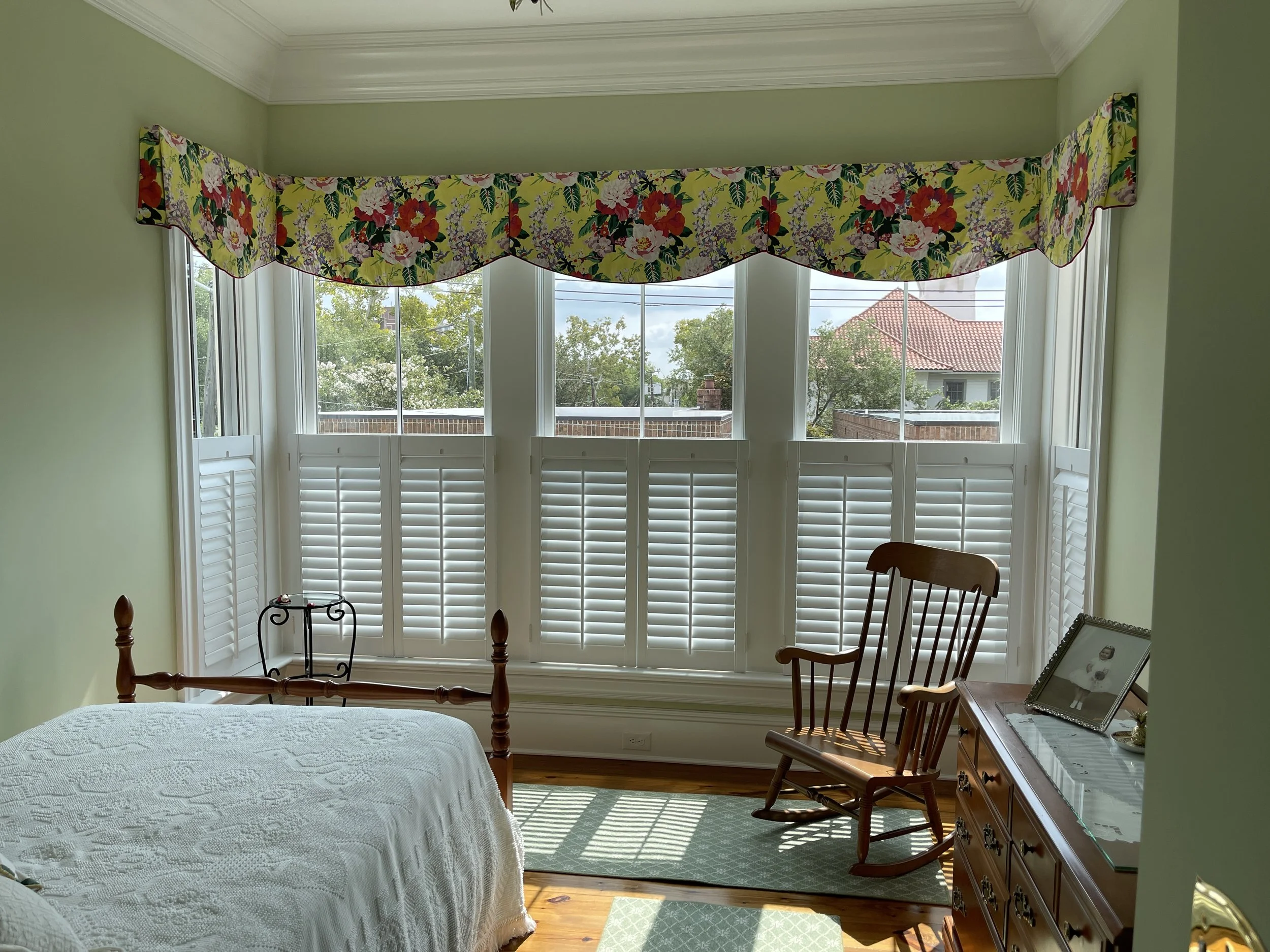   Valances can range from simple and modern with clean lines, to more traditional styles with swags and layers. Seen above is a shaped valance.  