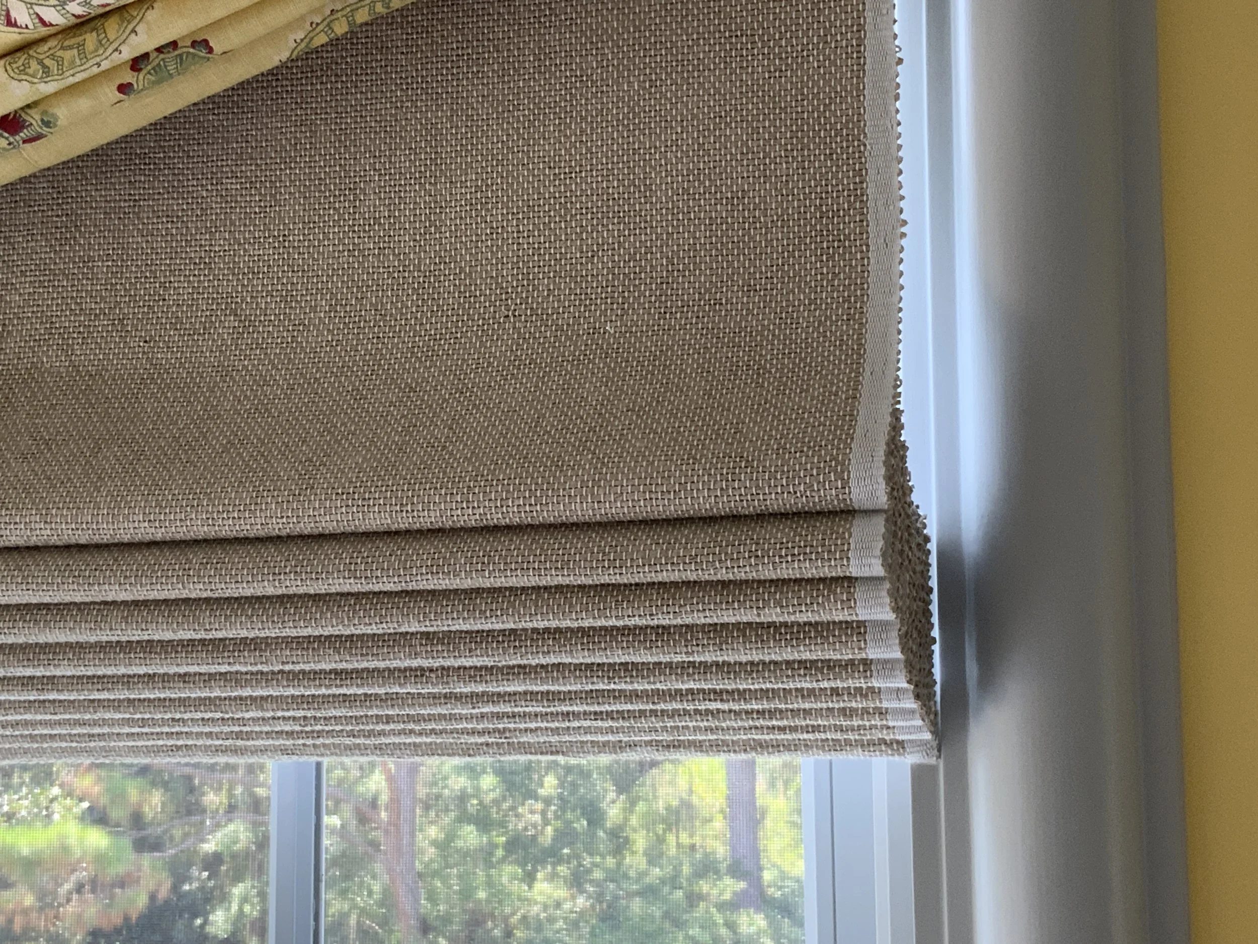   This Hartmann & Forbes woven wood shade is woven to size with a custom edge banding as part of the fabrication process.  