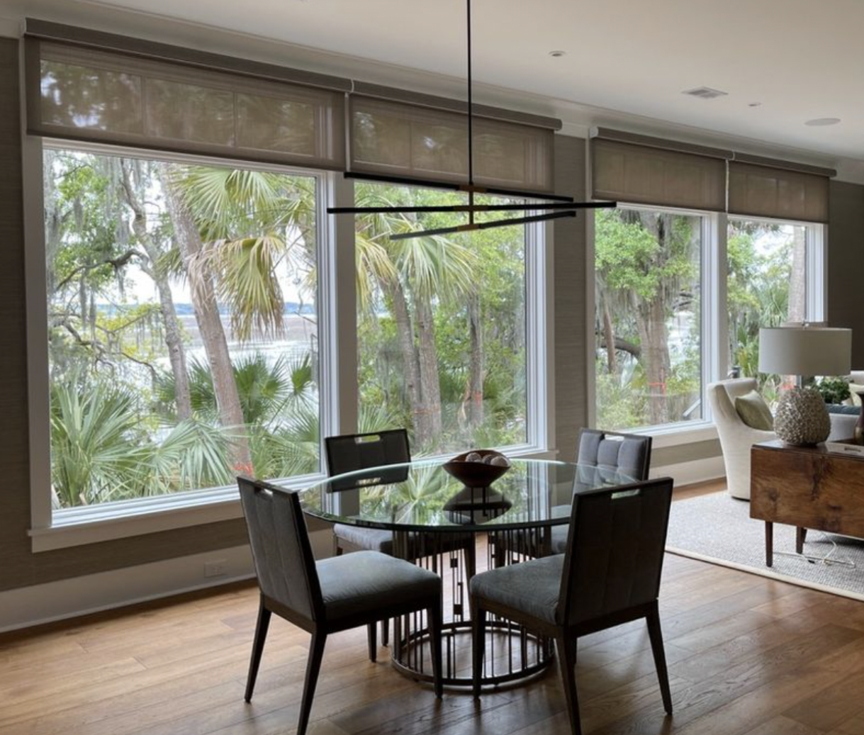 Solar shades are a contemporary window treatment solution perfect for kitchens and dining spaces. Design by GGL Designs.