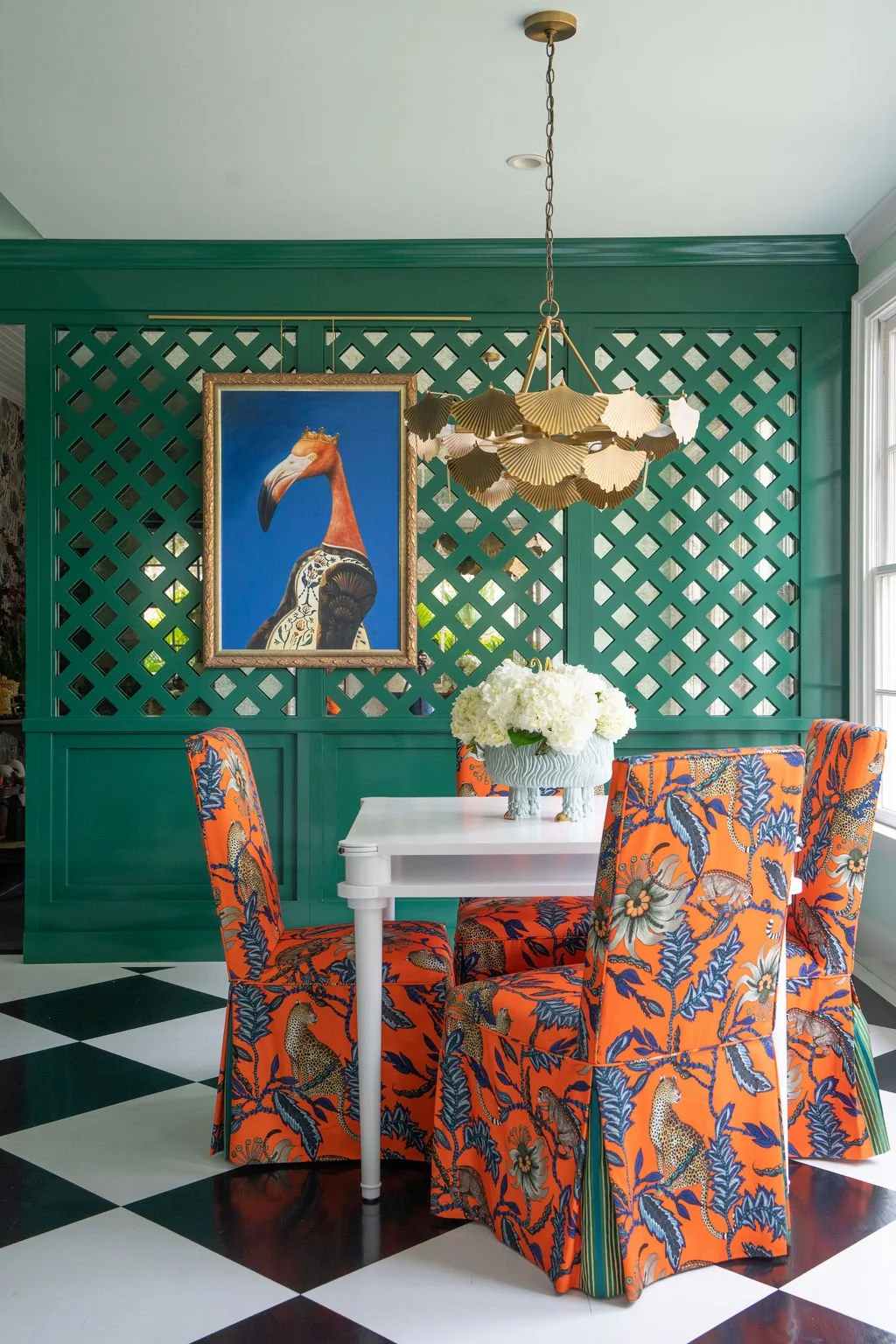 These vibrant dining chair slipcovers feature expertly matched patterns and contrasting inverted pleats. designed by William Peacock. Photography by Kelli Boyd Photography.