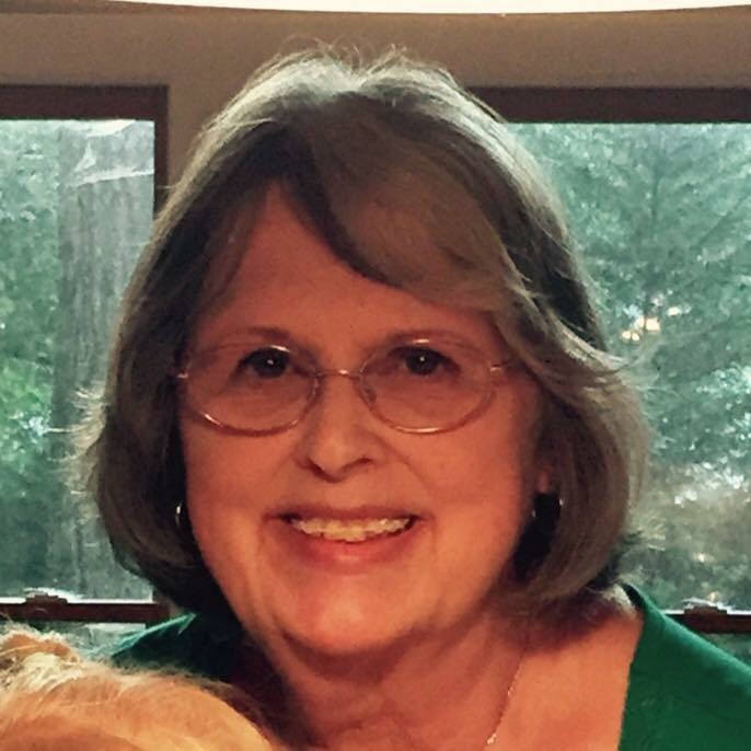 This is the face of a woman who loves people better than you probably do.