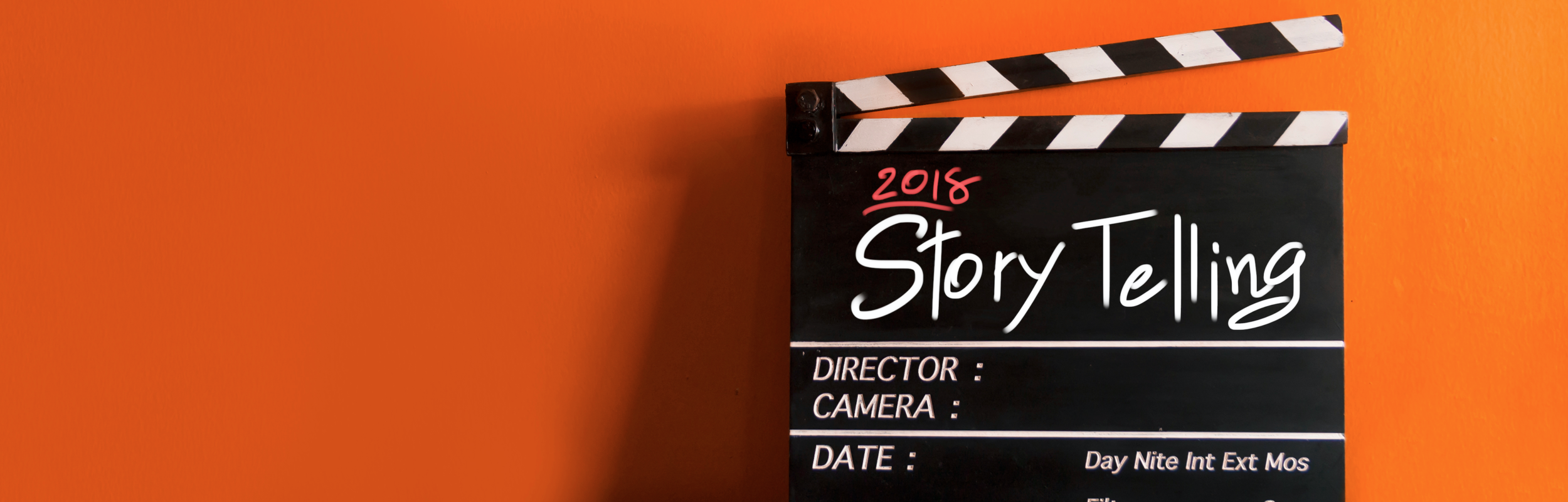 Image of clapperboard with text reading "Storytelling"