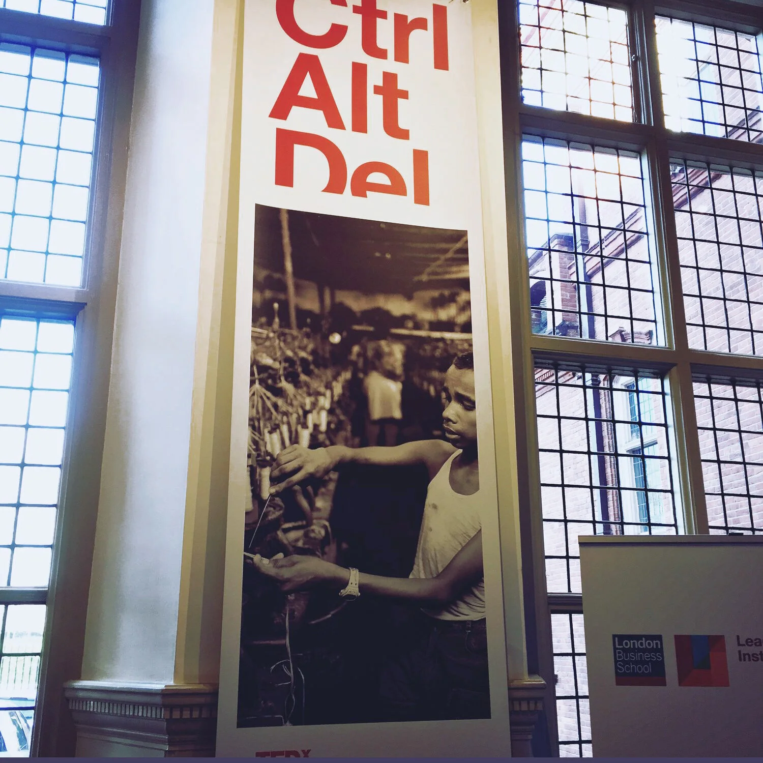 A Tedx event poster displaying the words 'Ctrl Alt Del' in large red letters at the top, with a black and white photograph.