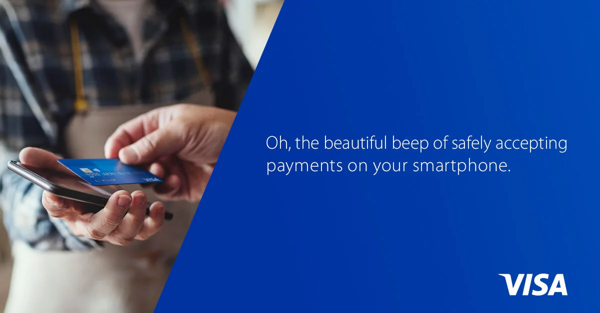 Visa digital banner of a person holding a smartphone with a contactless credit card displayed on the screen, and a blue background with text about contactless payments and the Visa logo.