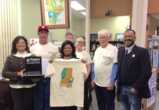 The Delta Center staff members recently greeted National Park Travelers Club members with MDNHA National Park Service Centennial passport t-shirts. Pictured are (l to r): Delta Center grad assistant Lydia Haley, David Kroese, Delta Center grad assis…