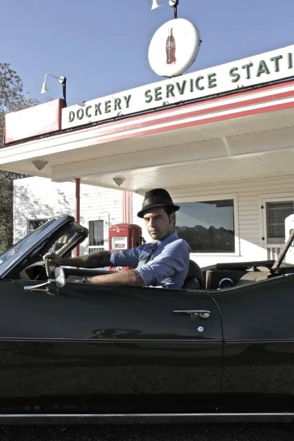 Manu Lanvin in Kossman’s 1972 LeMans convertible at historic Dockery Farms, known around the world as the birthplace of the Blues.