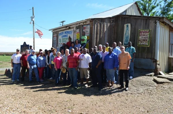 Dollar General administrators in front of Po' Monkey's Lounge in Merigold, MS. Photo by Lee Aylward.