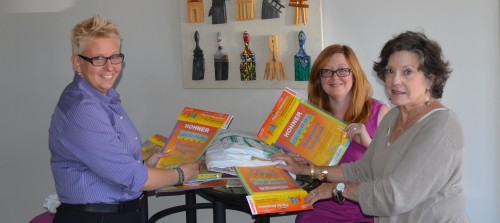 The Delta Center donates harmonicas to the Delta Arts Alliance to support musical classes.