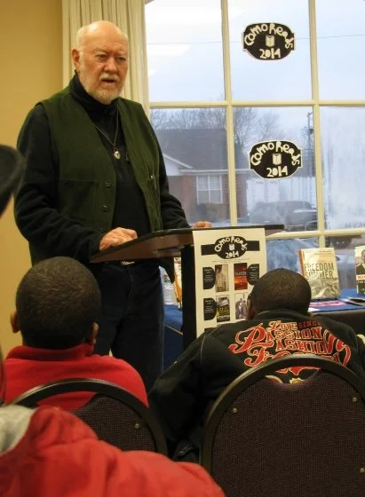 Dr. Henry Outlaw presenting at the Como library.