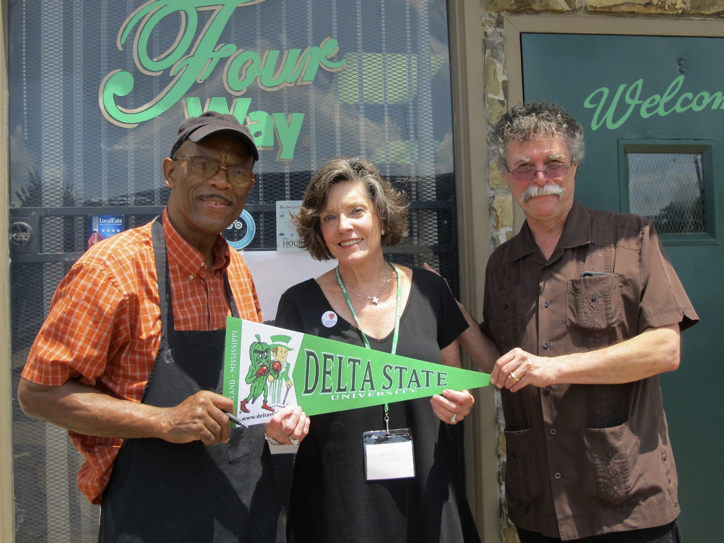 Photo: Restaurateur Willie Bates and the Delta Center’s Lee Aylward and Luther Brown in front of the Four Way Grill, 998 Mississippi Blvd, Memphis, TN 38126. Photo by Rachel Anderson.