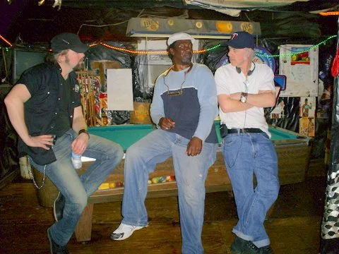 PHOTO: (L to R) Award-winning Country musician and TV personality Jason McCoy, Terry ”Harmonica” Bean, and TV producer Joel Stewart of CMT Canada, all at Po’ Monkey’s Lounge in Merigold, Mississippi, prior to shooting part of Jason McCoy Eats America.