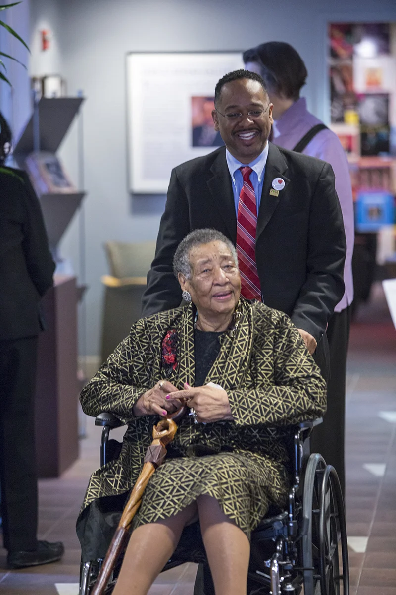 Dr. Rolando Herts of The Delta Center for Culture and Learning assists Mrs. Annyce P. Campbell as she arrives at the Smithsonian Anacostia Community Museum for the Delta Jewels program commemorating the National Park Service Centennial and Women’s History Month. Mrs. Campbell is a native of Mound Bayou, MS. Her portrait appears on the cover of Alysia Burton Steele’s Delta Jewels: In Search of My Grandmother’s Wisdom, a collection of oral histories and photographs of African American church mothers from the Mississippi Delta. (Photo courtesy of Smithsonian Institution)