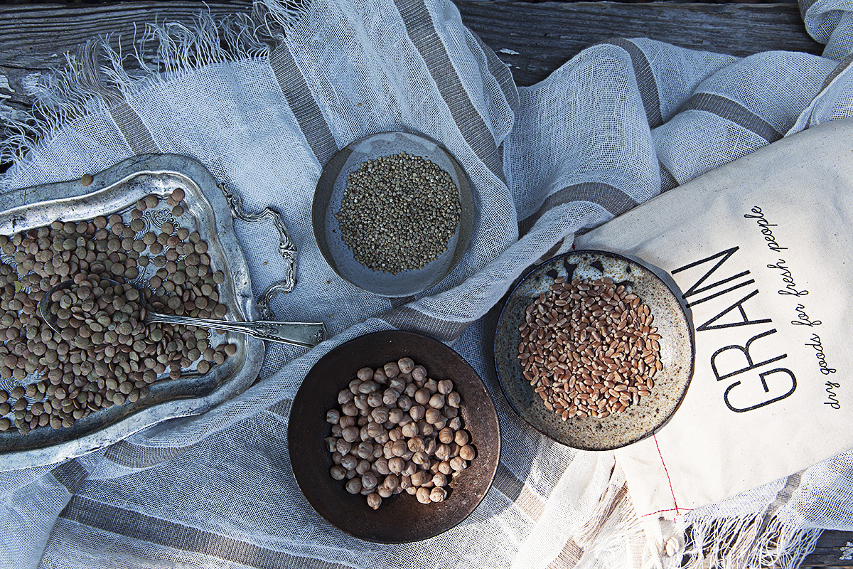 Clockwise from left: GRAIN's Laird Lentils, Golden Quinoa, Wheat Berries, and Kabuli Chickpeas. These four GRAIN products are available for purchase on our store shelves.
