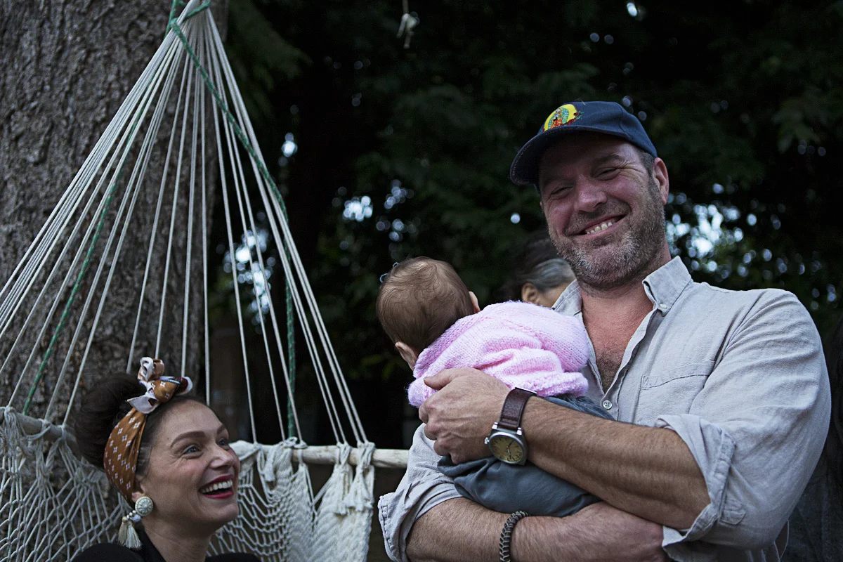 Pascal's turn to hold baby Ella!