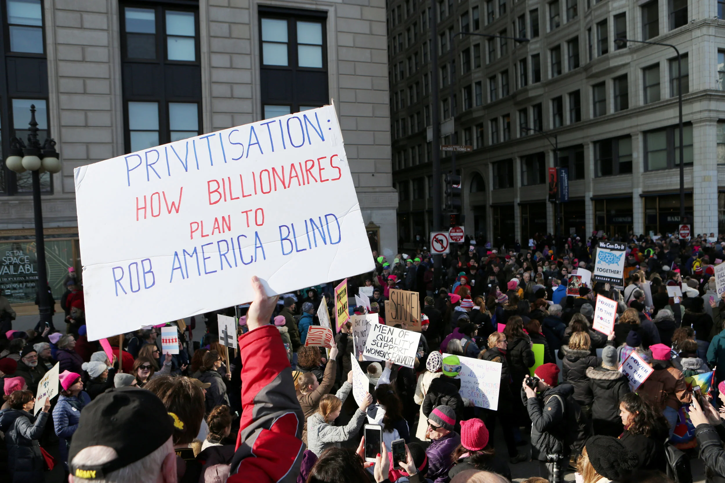  Demonstrators fill a closed-off Michigan Avenue during the Women's March Saturday, January 20, 2018 in Chicago, Ill. Organizers estimate nearly 300,000 people attended the event. 
