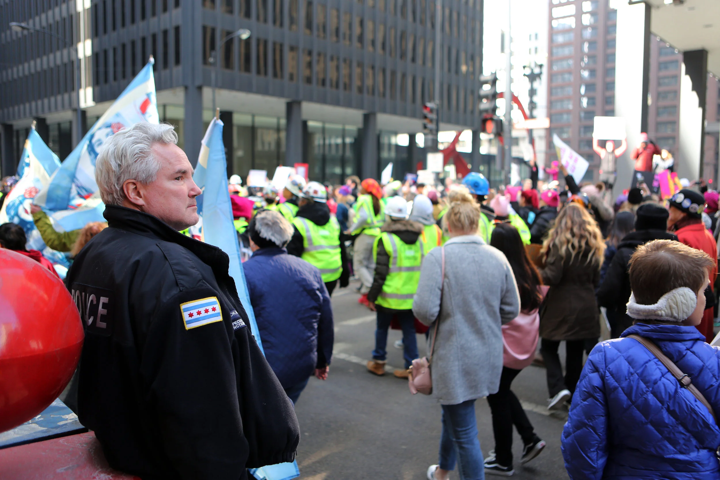  A Chicago police officer stands guard during a peaceful demonstration Saturday, January 20, 2018 in Chicago, Ill. 