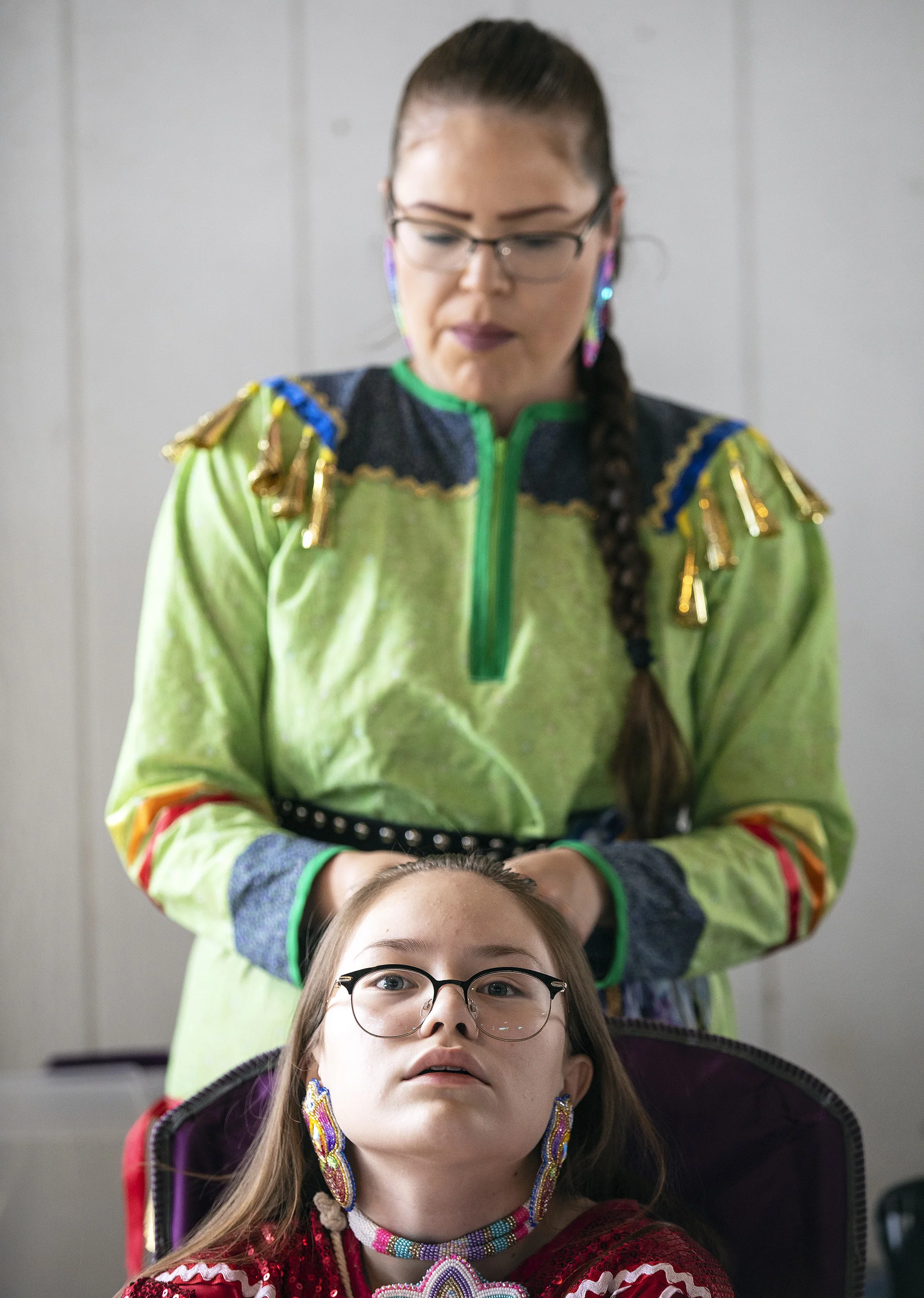  Desirae Desnomie braids the hair of her daughter, Aiyana Burnstick, 13, before the Grand Entry of Milk River Indian Days on Sunday, July 28, 2019 at Fort Belknap Indian Reservation, Montana. 