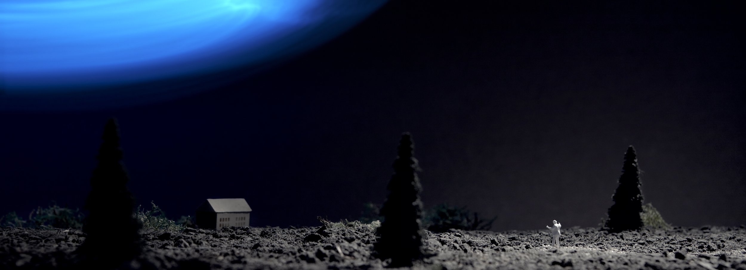 Dystopian landscape, with Russian wooden house and blue light in the sky.