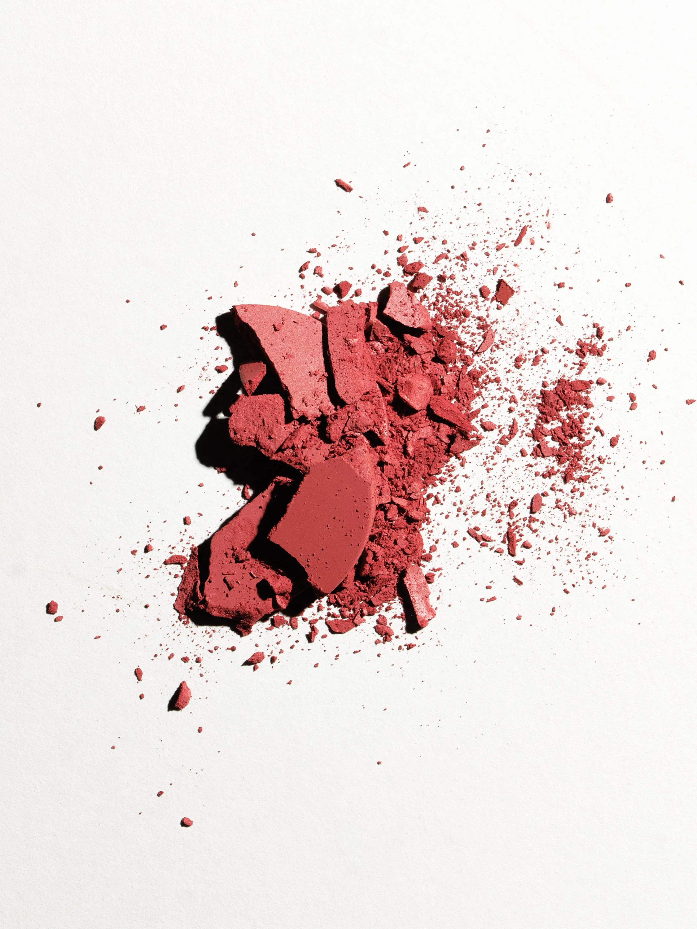 colourful broken make up on a white surface