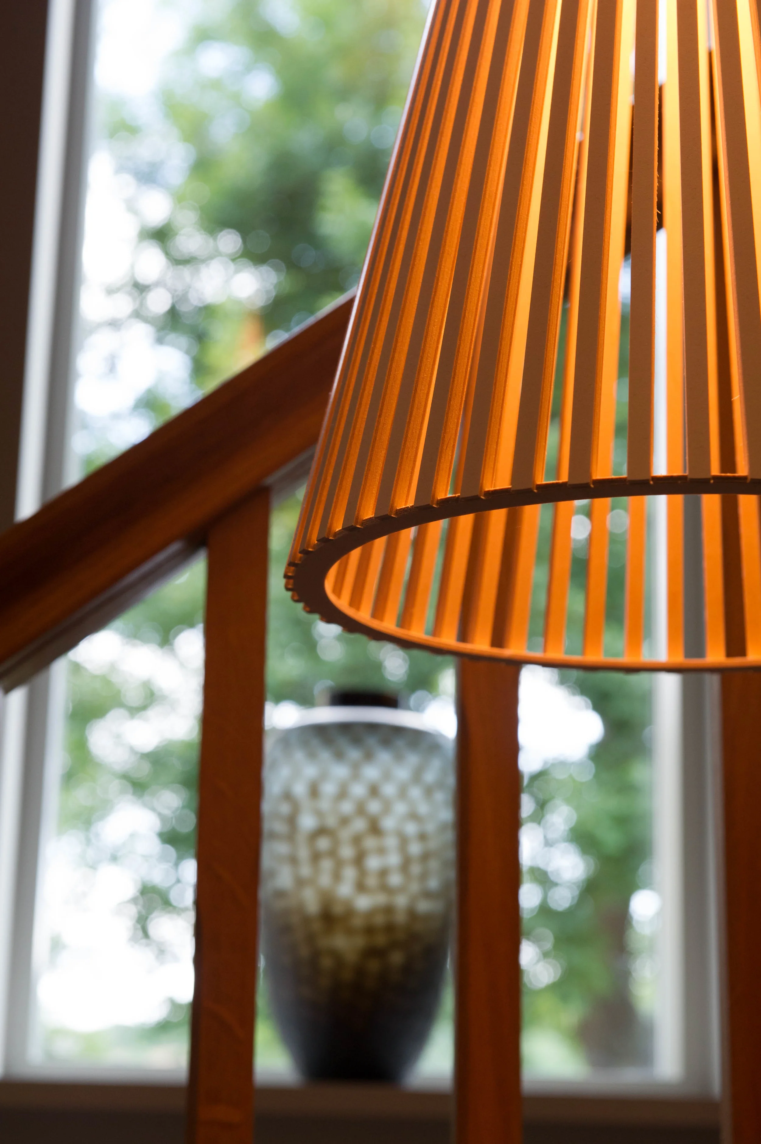 Detail of modern, timber pendant light by Secto Lighting.
