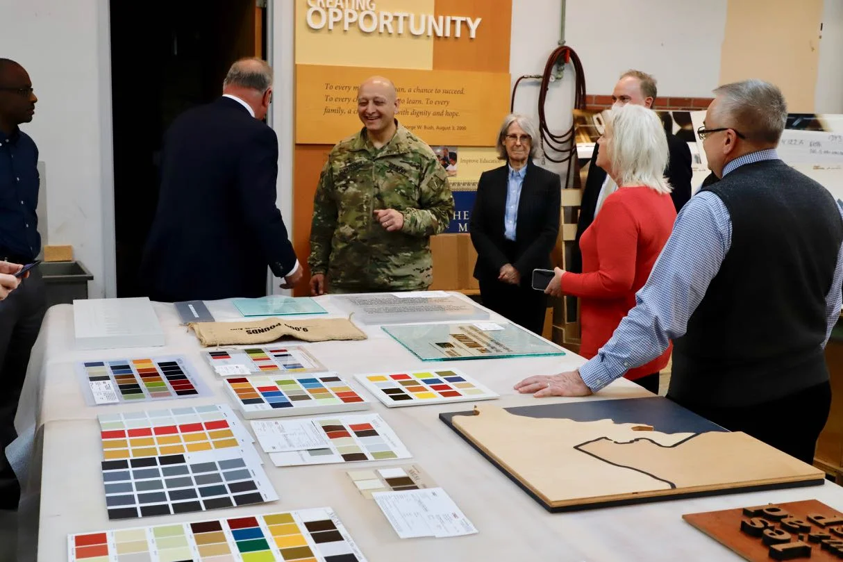 MG Anthony C. Funkhouser and National Museum of the United States Army staff members review graphic samples.