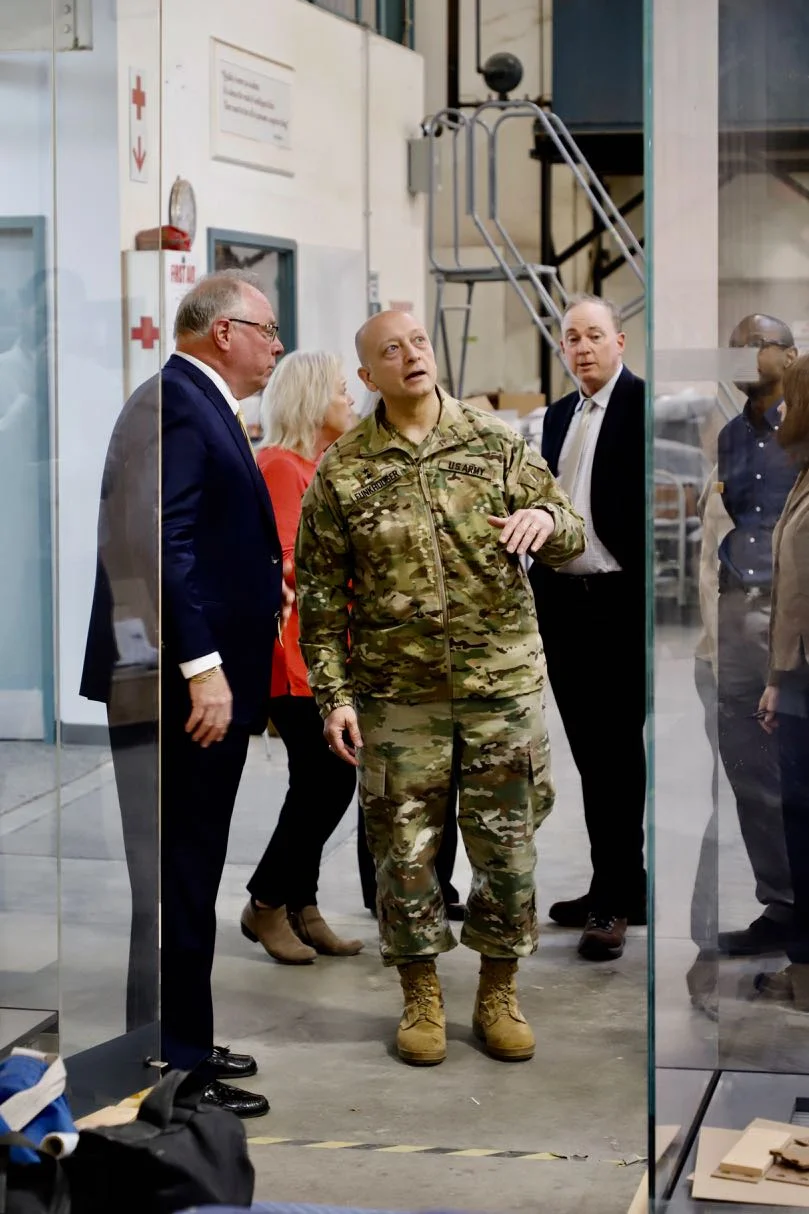 D&P company president J.F. Barnwell shows display cases to MG Anthony C. Funkhouser and National Museum of the United States Army staff.