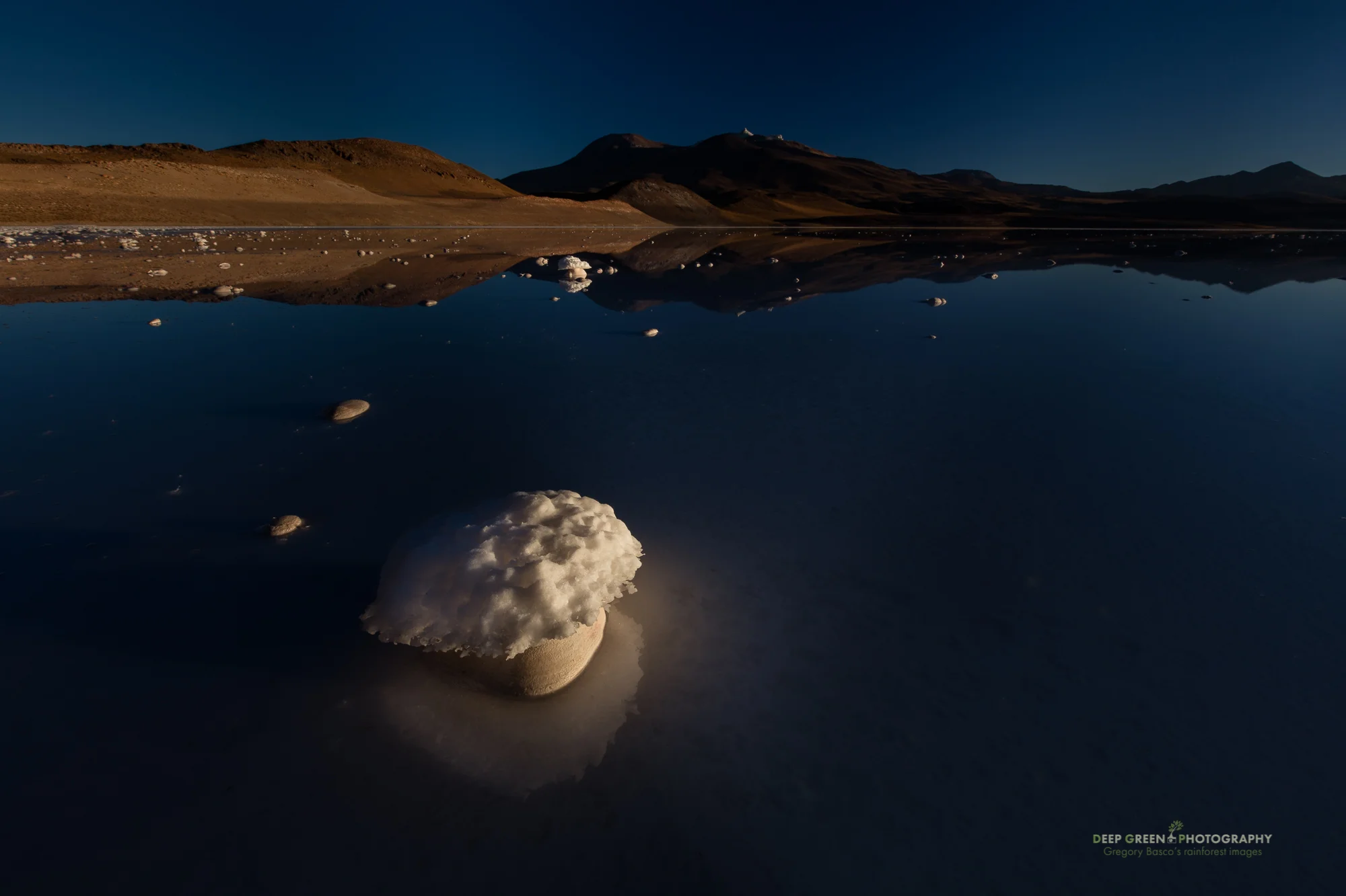 A salt lake at nearly 15,000 feet elevation at sunrise in the high mountains of the Atacama Desert in Chile