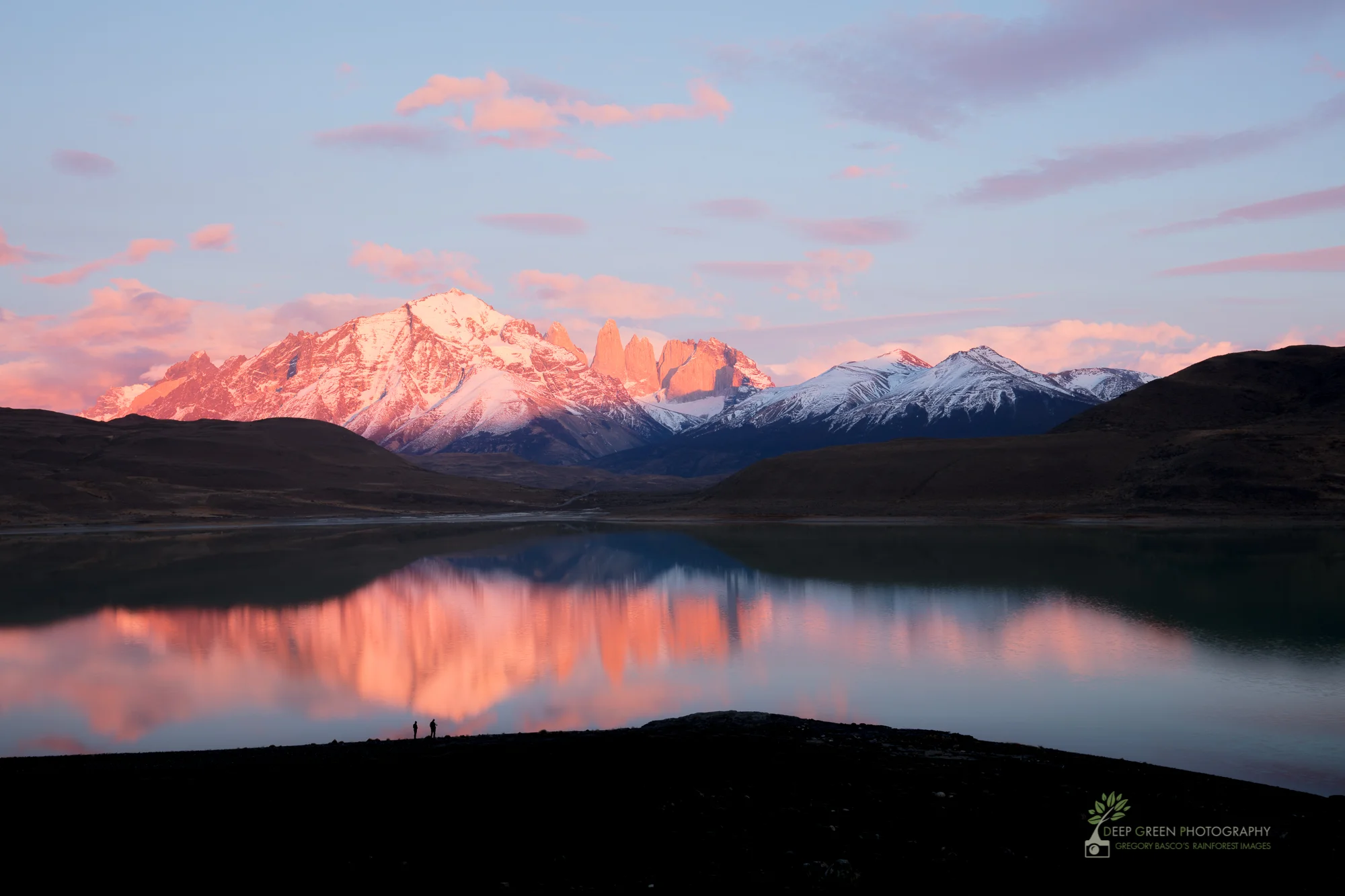 tourists at sunrise in Torres del Paine National Park, Chile