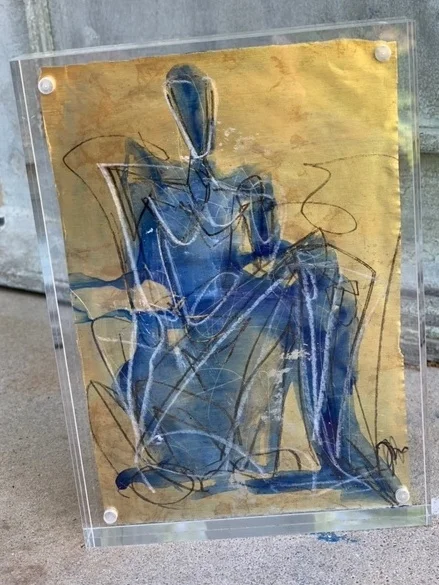 Gold Leaf figure under Plexiglass