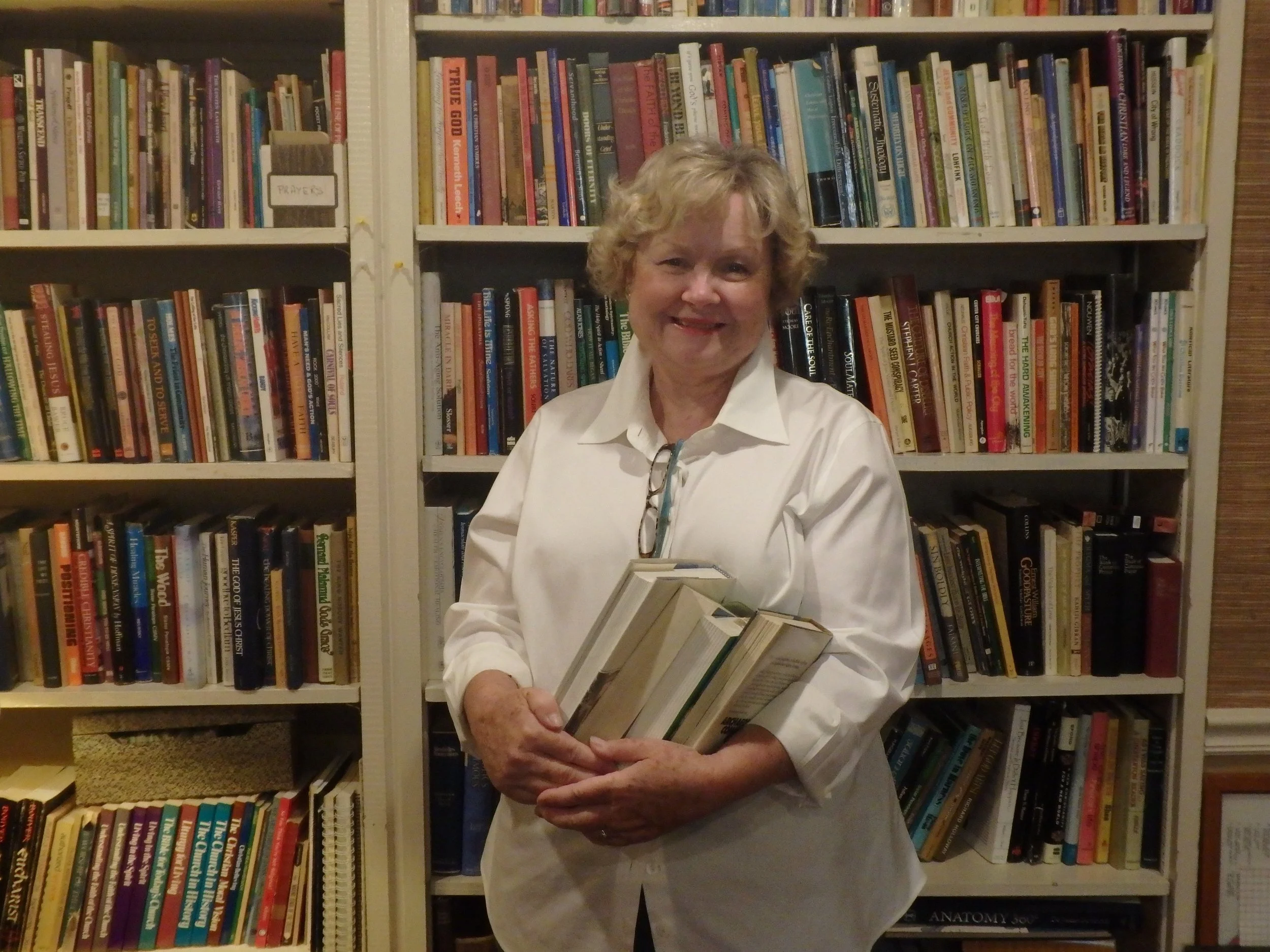 Beverly Sanderson uses the written word to lead discussions with members of the "Communication Club". 