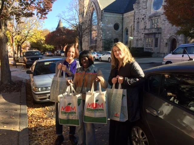 Baltimore Shambhala Center members donate Thanksgiving meals to Samaritan Community.