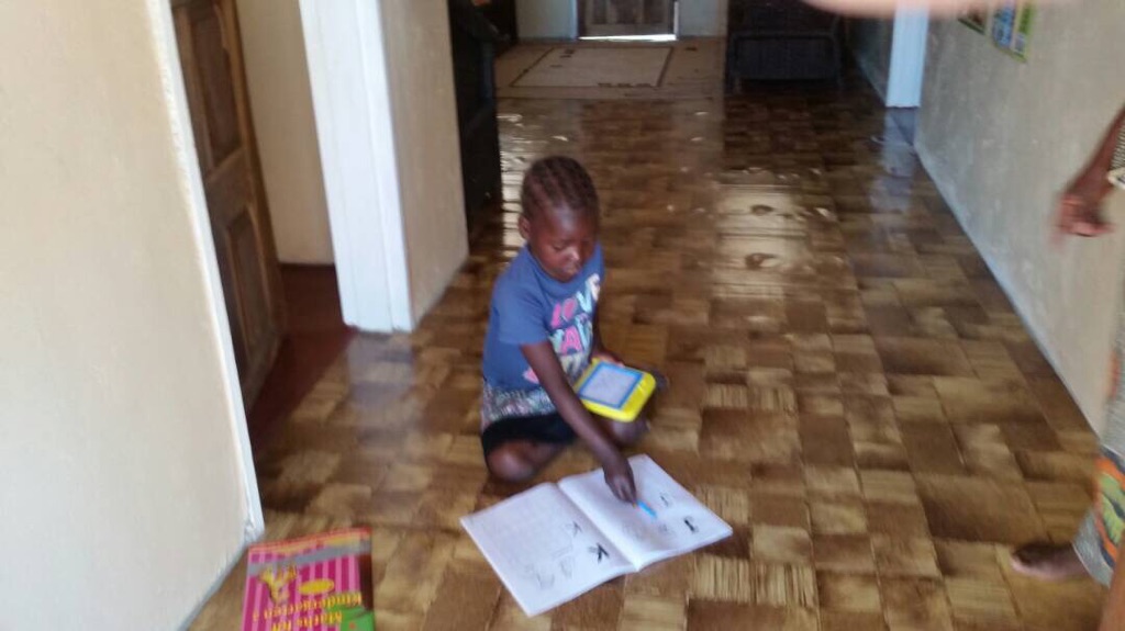 Beauty teaches Josephine writing and spelling each morning!
